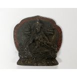 A Tibetan devotional bronze deity figure with remnants of red pigment, H. 6cm.