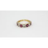 A 9ct yellow gold ring set with with rubies and brilliant cut diamonds, (Q).