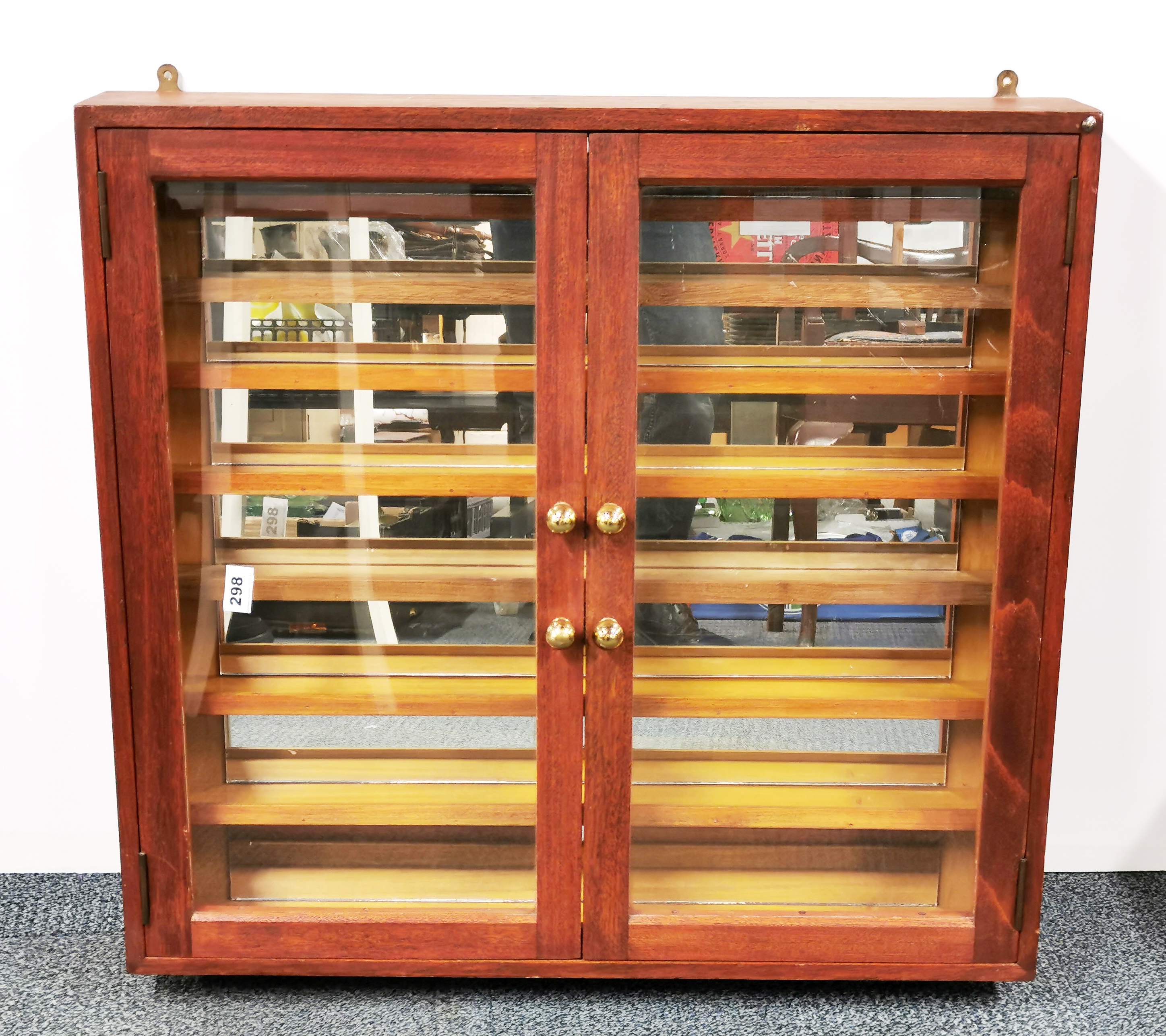 A wall mounted mahogany collectors display cabinet, 76cm x 72cm x 12cm.
