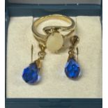 A 9ct gold opal set dress ring and a pair of earrings, ring size K.