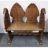 A 19th century gothic style oak hall bench, 86cm x 94cm.