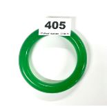 A 12.5mm dia. green jade bangle, internal dia. 5.8cm.