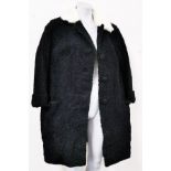 A vintage fur trimmed astrachan coat.