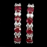 A pair of 925 silver earrings set with swiss cut rubies and white stones, L. 2.1cm.