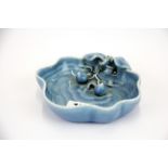 An unusual Chinese pale blue glazed porcelain brush washing bowl, relief decorated with a bat and