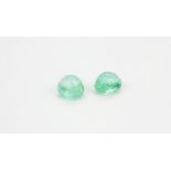 Two unmounted cabochon cut emeralds, approx. 7.7ct.