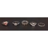 Five 925 silver stone set rings.