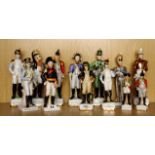 A group of 13 hand painted porcelain figures of historical soldiers, tallest H. 26cm.