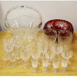 A large cut crystal fruit basket with a cut crystal fruit bowl and a group of glassware.