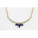 An 18ct yellow gold (stamped 750) necklace set with marquise cut sapphires and brilliant cut