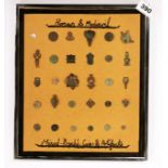 A framed group of Roman and Medieval bronze coins and other items.