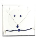 A silver and lapis lazuli pendant and earrings with a lapis lazuli bracelet