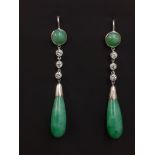 A pair of white metal (tested high carat gold) drop earrings set with cabochon cut nephrite jade and