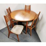 A 1970's extending circular teak dining table, dia. 120cm with a set of four chairs. (Without leaves