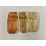 Three Chinese carved rock crystal cicada amulets, L. 6cm.