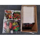 A box of 98 DC and Marvel comics.