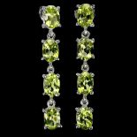 A pair of 925 silver drop earrings set with oval cut peridots, L. 3.1cm.