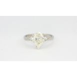 A platinum ring set with a 1.91ct pear cut diamond flanked by trillion cut diamonds, (N).