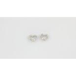 A pair of 18ct white gold (stamped 750) heart shaped earrings set with brilliant cut diamonds, L.