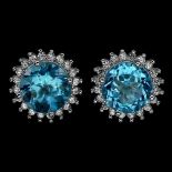 A pair of 925 silver stud earrings set with round cut Swiss blue topaz and white stones, Dia. 1.