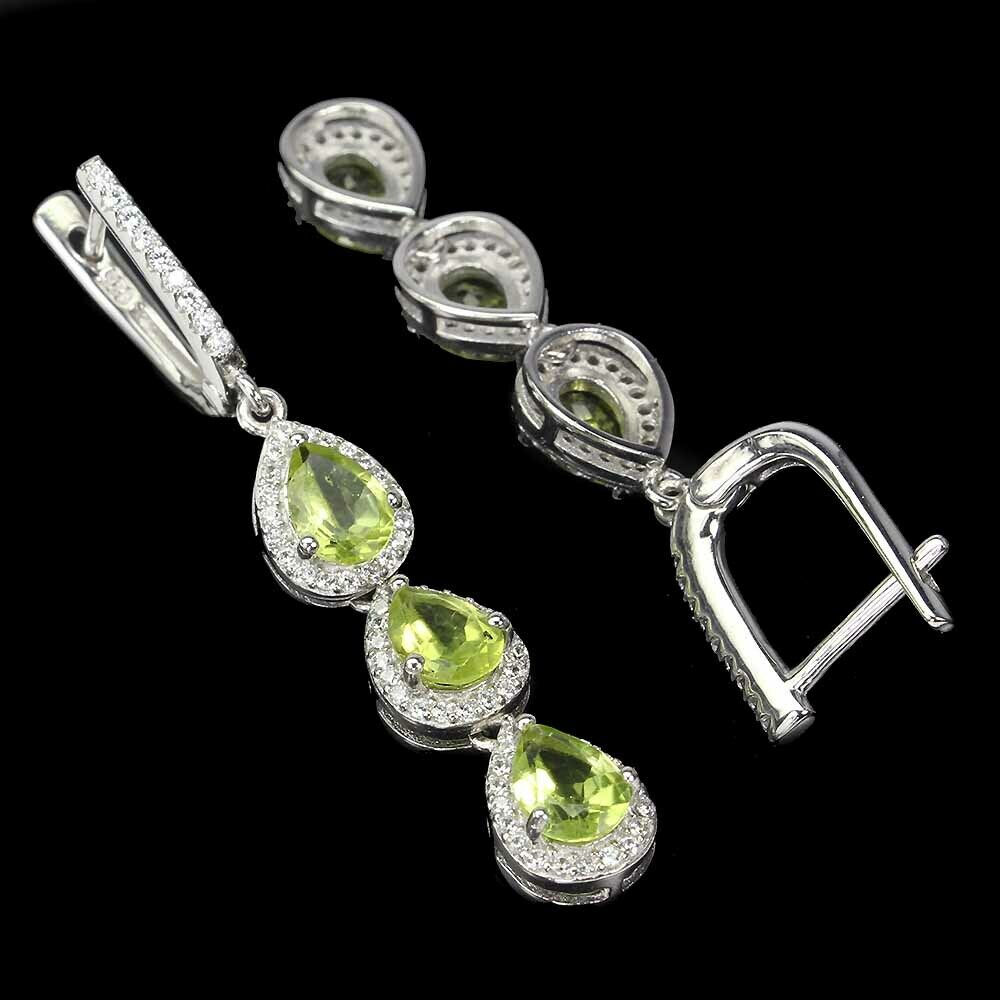 A pair of 925 silver drop earrings set with pear cut peridots and white stones, L. 4.7cm. - Image 2 of 2