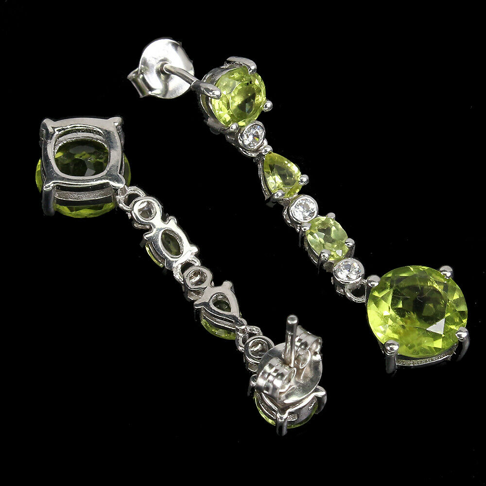 A pair of 925 silver drop earrings set with round and oval cut peridots and white stones, L. 3.5cm. - Image 2 of 2