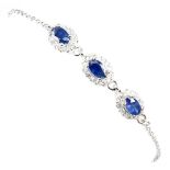 A 925 silver bracelet set with oval cut sapphires and white stones, L. 17cm.