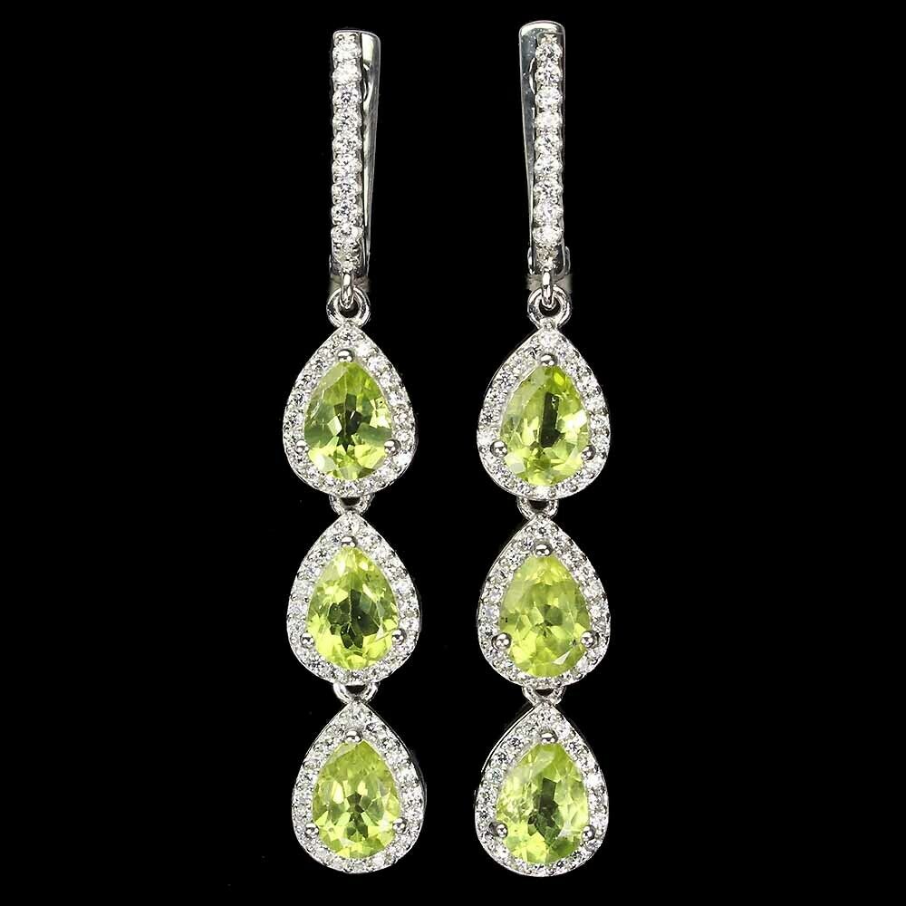 A pair of 925 silver drop earrings set with pear cut peridots and white stones, L. 4.7cm.