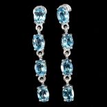 A pair of 925 silver drop earrings set with oval cut blue topaz, L. 4cm.