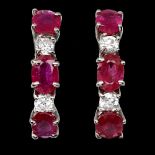 A pair of 925 silver earrings set with rubies and white stones, L. 1.5cm.