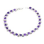 A 925 silver bracelet set with round cut amethysts, L. 18cm.