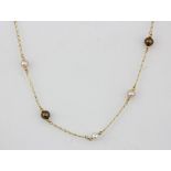 An 18ct yellow gold pearl set necklace, L. 42cm.
