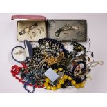 A box of mixed costume jewellery and other items.