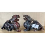 A pair of Chinese carved soapstone dragon figures, H. 10cm. L. 15cm.