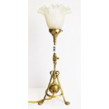 A 19th C brass adjustable desk lamp, registered number 410258, with glass shade, H. 47cm.