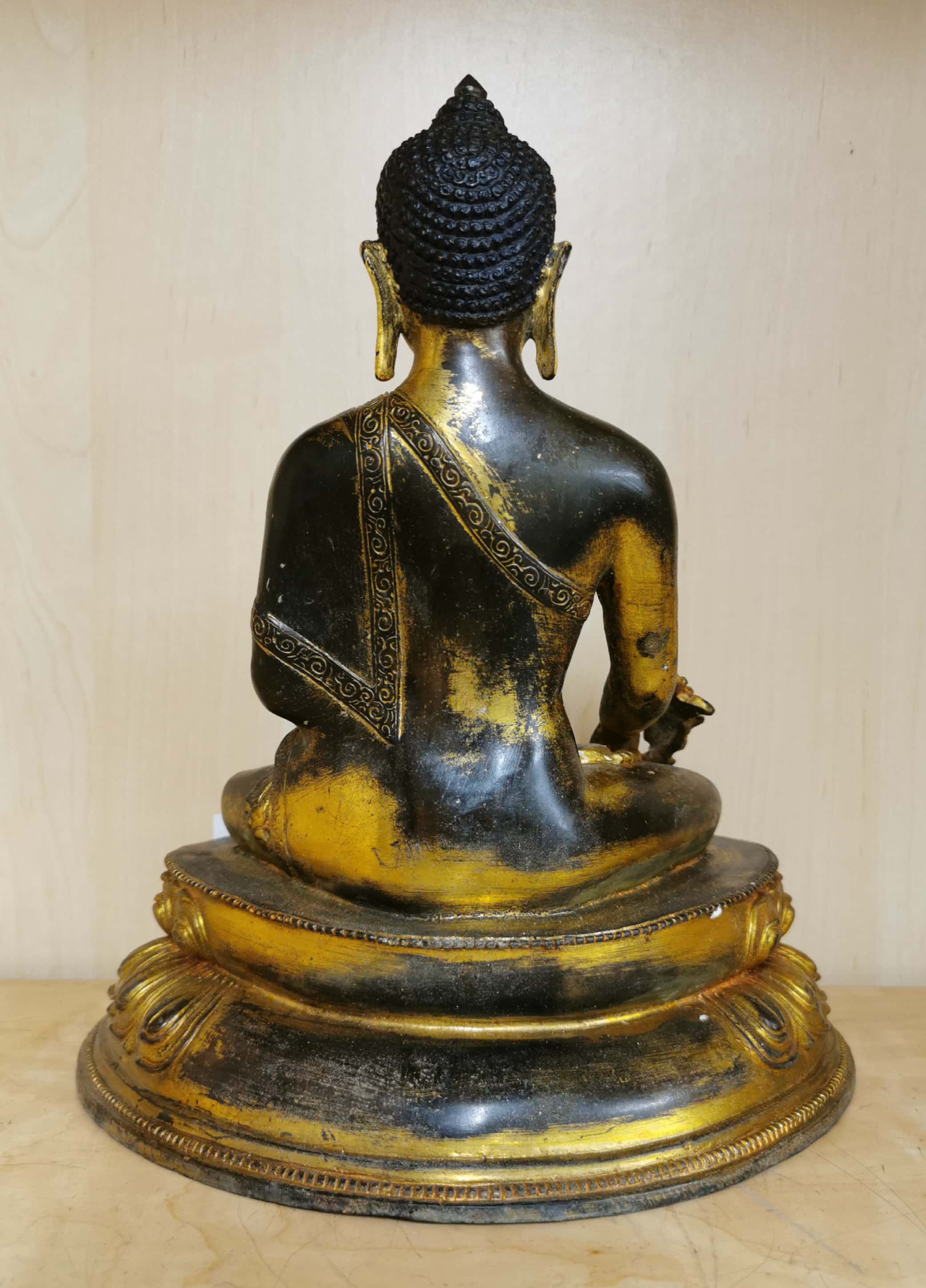 A Tibetan temple quality gilt and hand painted bronze figure of a seated Buddha, H. 27cm. - Image 2 of 3