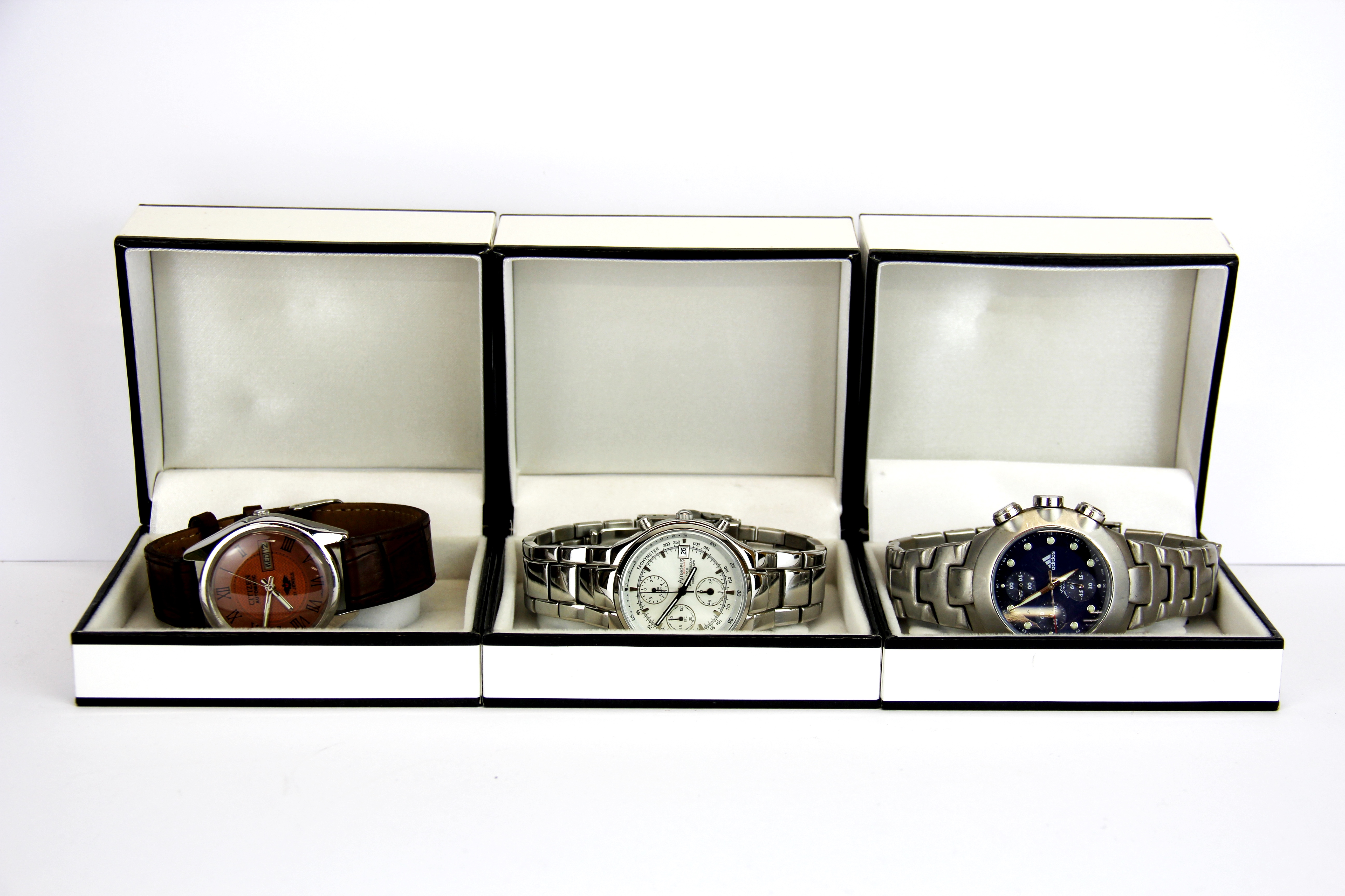 Three boxed gent's watches, Adidas, Amadeus and Citizen.