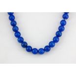 A 9ct yellow gold (stamped 9k) gold and polished chalcedony bead necklace, L. 18cm.