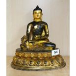 A Tibetan temple quality gilt and hand painted bronze figure of a seated Buddha, H. 27cm.