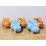 A group of four Sylvac type rabbit figures, 9cm.