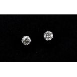A pair of 900 platinum stud earrings set with brilliant cut diamonds, approx. 0.50ct overall.
