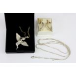 A pair of silver stone set earrings and a silver stone set angel pendant and chain.