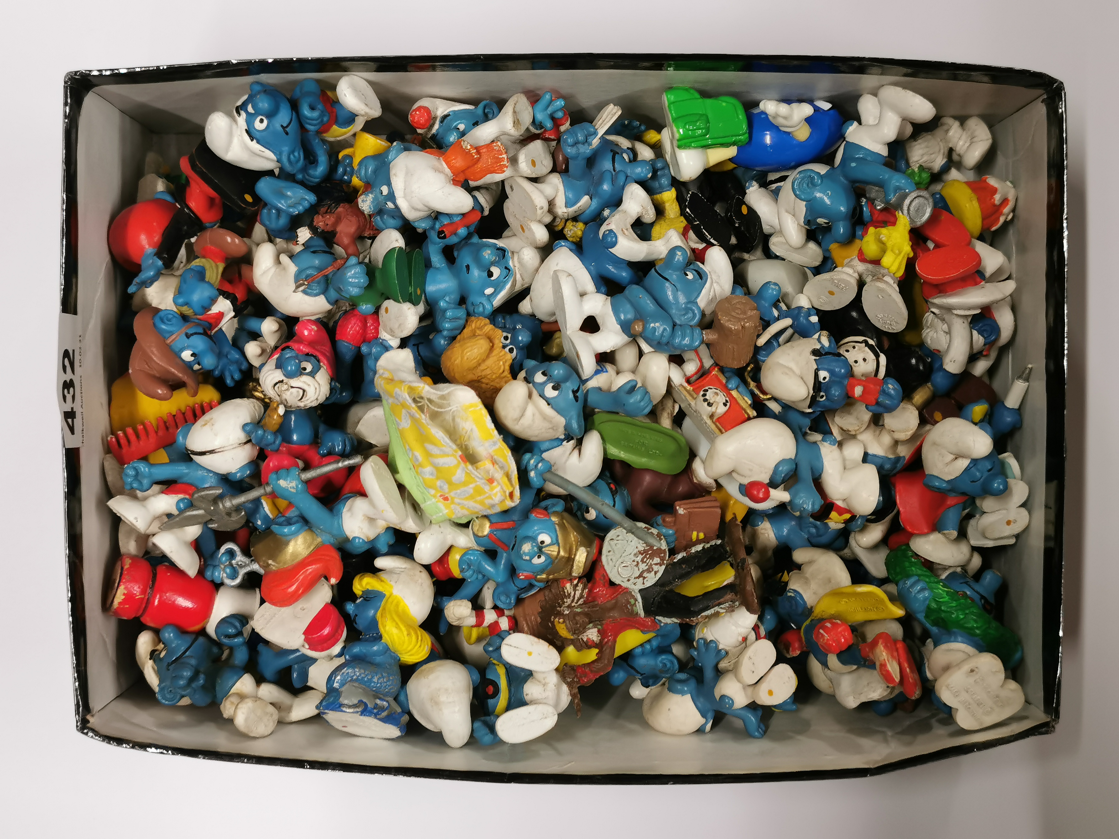 A box of original Smurf toys.