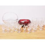 A large cut crystal fruit basket with a cut crystal fruit bowl and a group of glassware.