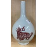A Chinese pale celadon glazed porcelain vase with underglaze blue and red decoration of Qilin, H.