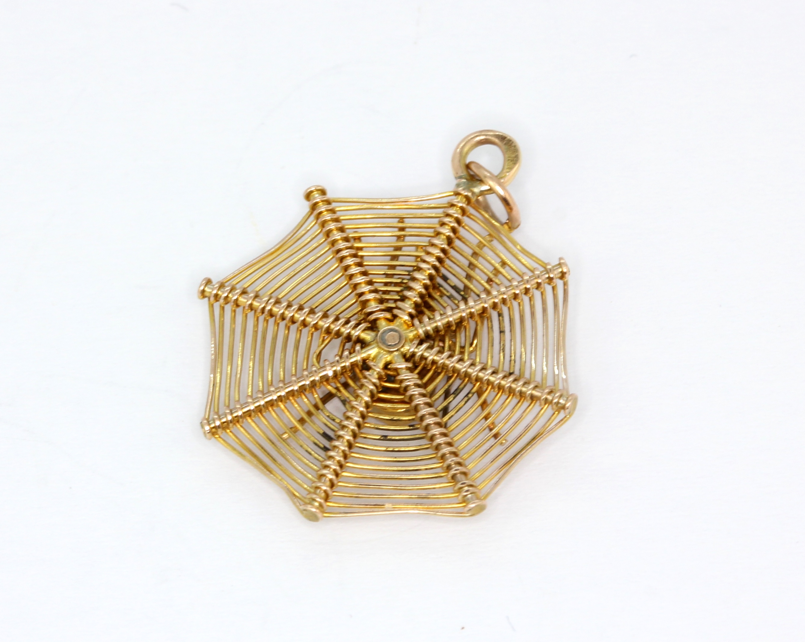 A 9ct yellow gold (stamped 9ct) spider web shaped pendant, set with mother of pearl and emeralds, L. - Image 3 of 3
