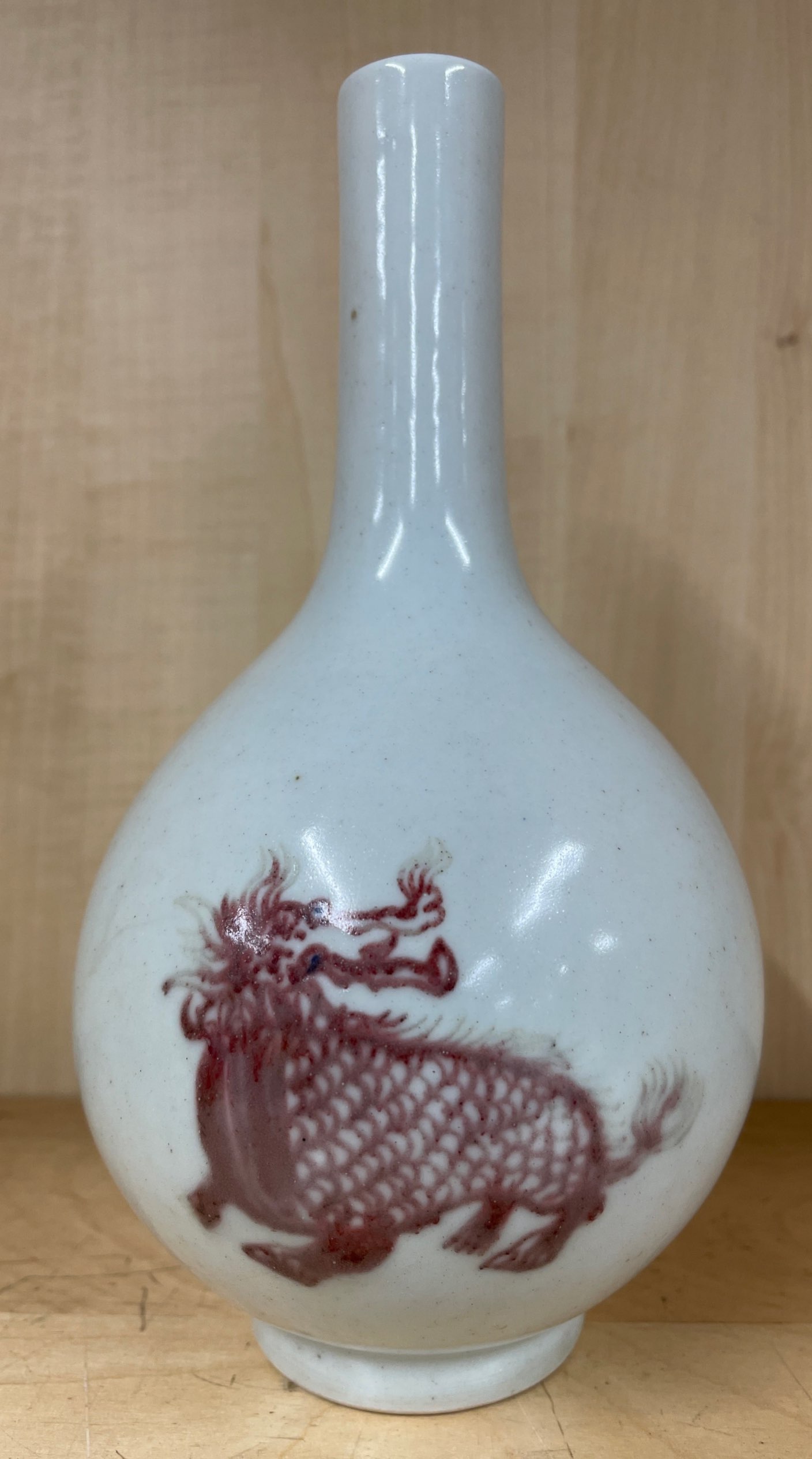 A Chinese pale celadon glazed porcelain vase with underglaze blue and red decoration of Qilin, H. - Image 2 of 3