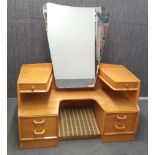 A 1970's G-plan elm dressing table, 122 x 142cm.