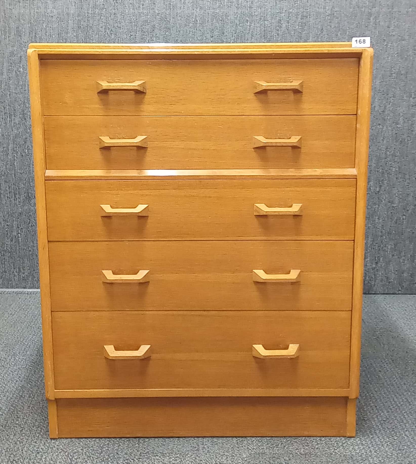A 1970's G-plan elm five drawer chest, 76 x 46 x 97cm.