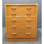 A 1970's G-plan elm five drawer chest, 76 x 46 x 97cm.